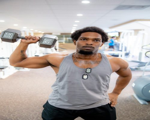 Man lifting dumbbells in a strength training session